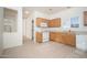 Bright kitchen with neutral tile flooring and white appliances at 15518 W Ocotillo Ln, Surprise, AZ 85374