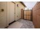 Paver patio and side yard access from an exterior utility door at 16551 W Winston Dr, Goodyear, AZ 85338