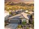 Charming single-Gathering home with a two-car garage and desert landscaping with mountain views at 16551 W Winston Dr, Goodyear, AZ 85338