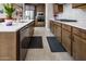 Sleek kitchen design with stainless steel appliances, ample counter space, and abundant storage solutions at 16551 W Winston Dr, Goodyear, AZ 85338