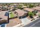 Overhead view of a home showcasing a well-kept yard, solar panels, and an inviting outdoor shed at 17531 W Fetlock Trl, Surprise, AZ 85387