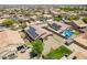 Bird's eye view of a house featuring solar panels, a pool, and artificial turf in a community setting at 17531 W Fetlock Trl, Surprise, AZ 85387
