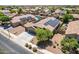 Aerial view of a neighborhood home featuring solar panels and landscaped surroundings, a smart and eco-friendly choice at 17531 W Fetlock Trl, Surprise, AZ 85387