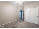 Bedroom with ceiling fan and large closet with sliding doors at 17531 W Fetlock Trl, Surprise, AZ 85387