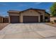 Charming single-story home featuring a three-car garage and a well-maintained desert landscape at 17531 W Fetlock Trl, Surprise, AZ 85387