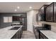 Open-concept kitchen featuring an island, stainless steel appliances, and modern cabinetry at 17531 W Fetlock Trl, Surprise, AZ 85387