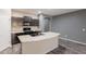 A kitchen showcasing modern appliances and a central island perfect for food preparation and entertaining at 17531 W Fetlock Trl, Surprise, AZ 85387