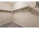 Walk-in closet showing installed shelving for clothing and other storage items at 17531 W Fetlock Trl, Surprise, AZ 85387