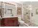 Updated bathroom featuring a glass-enclosed shower, modern vanity, framed mirror and tiled flooring at 18626 N 130Th Ave, Sun City West, AZ 85375