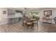 Dining area showcasing an elegant table with seating for six, stylish cabinetry, and views to the outdoors at 18626 N 130Th Ave, Sun City West, AZ 85375