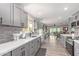 Open-concept kitchen with granite countertops, and modern appliances, perfect for cooking and entertaining at 18626 N 130Th Ave, Sun City West, AZ 85375