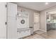 Charming mud room with built-in bench, storage, and coat hooks, creating an inviting and functional space at 18626 N 130Th Ave, Sun City West, AZ 85375