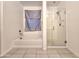 Well-lit bathroom featuring a separate tub and shower with modern fixtures at 19954 W Moonlight Path, Buckeye, AZ 85326