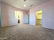 Bright bedroom with plush carpeting, pink walls, and easy access to a walk-in closet at 19954 W Moonlight Path, Buckeye, AZ 85326