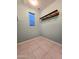 Walk in closet with tile flooring and pipe shelving for storage at 19954 W Moonlight Path, Buckeye, AZ 85326