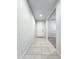 Hallway with tile flooring leading to the front door at 19954 W Moonlight Path, Buckeye, AZ 85326