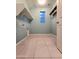 Laundry room with tile flooring, utility sink, and custom metal piping shelving at 19954 W Moonlight Path, Buckeye, AZ 85326