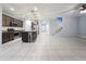 Spacious living room with a modern kitchen and large island, perfect for entertaining at 19954 W Moonlight Path, Buckeye, AZ 85326