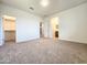 Expansive main bedroom with plush carpeting and an ensuite bathroom at 19954 W Moonlight Path, Buckeye, AZ 85326
