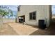 Spacious backyard featuring a patio, an AC unit, a retaining wall, and a gravel ground cover at 22507 N 31St Ave # 11, Phoenix, AZ 85027