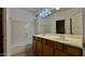 Bathroom with a double sink vanity and tub with shower at 22507 N 31St Ave # 11, Phoenix, AZ 85027