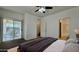 Spacious primary bedroom with a sliding door and a ceiling fan at 22507 N 31St Ave # 11, Phoenix, AZ 85027