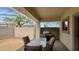 Outdoor patio featuring a shaded area, table and chairs, grill, and a view of the backyard at 22507 N 31St Ave # 11, Phoenix, AZ 85027