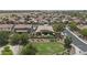 Home with backyard oasis, showcasing landscaping, patio, and neighborhood view from above at 2466 E Aris Dr, Gilbert, AZ 85298