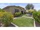 Lush backyard showcasing manicured lawn, vibrant plants, and outdoor entertainment space at 2466 E Aris Dr, Gilbert, AZ 85298
