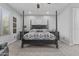 Well-lit bedroom features a four-poster bed, with carpeted floors, and neutral wall color at 2466 E Aris Dr, Gilbert, AZ 85298