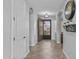 Welcoming hallway featuring tile flooring, arched doorways, and a decorative front door at 2466 E Aris Dr, Gilbert, AZ 85298
