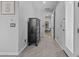 Hallway with door, carpet, and dresser at 2466 E Aris Dr, Gilbert, AZ 85298