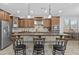 Kitchen featuring stainless steel appliances, granite countertops, tile backsplash, and breakfast bar seating at 2466 E Aris Dr, Gilbert, AZ 85298