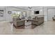 Cozy living room with a fireplace, ceiling fan, and comfortable seating arrangement at 2466 E Aris Dr, Gilbert, AZ 85298