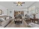 Open living area with a view to the kitchen, comfortable seating, and stylish decor at 2466 E Aris Dr, Gilbert, AZ 85298