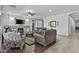 Spacious living room with fireplace, ceiling fan, tile floors and comfortable seating at 2466 E Aris Dr, Gilbert, AZ 85298