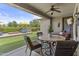 Inviting covered patio featuring comfortable seating and views of the landscaped backyard at 2466 E Aris Dr, Gilbert, AZ 85298