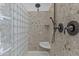 Walk-in shower features glass block partition, stone surround, showerhead and handheld sprayer at 2466 E Aris Dr, Gilbert, AZ 85298