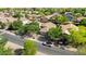 A panoramic aerial shot highlights the serene community, with each home beautifully spaced and surrounded by greenery at 2551 W Sawtooth Way, San Tan Valley, AZ 85144