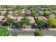 Aerial view of the neighborhood showcasing lush greenery, well-maintained homes, and community streets at 2551 W Sawtooth Way, San Tan Valley, AZ 85144
