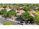 An aerial perspective shows a well-spaced suburban neighborhood with mature trees and a sense of community at 2551 W Sawtooth Way, San Tan Valley, AZ 85144
