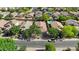 A broad aerial view reveals a close-knit community, known for its tree-lined streets and accessible neighborhood amenities at 2551 W Sawtooth Way, San Tan Valley, AZ 85144