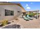 Outdoor patio area with furniture, grill, and comfortable lounge chairs in the backyard at 2551 W Sawtooth Way, San Tan Valley, AZ 85144