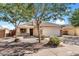 Lovely single-Gathering home showcasing desert landscaping, a stone-accented facade, and a spacious two-car garage at 2551 W Sawtooth Way, San Tan Valley, AZ 85144