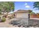 Charming single-story home with a well-manicured front yard, stone accents, and a spacious two-car garage at 2551 W Sawtooth Way, San Tan Valley, AZ 85144