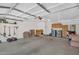 Spacious garage featuring ample storage with built-in cabinets and a laundry area with a washer and dryer hookup at 2551 W Sawtooth Way, San Tan Valley, AZ 85144