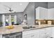 Modern kitchen boasts granite countertops, stainless steel appliances, and a view of the patio at 2551 W Sawtooth Way, San Tan Valley, AZ 85144