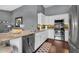 Bright kitchen featuring stainless steel appliances, granite countertops, and white cabinetry at 2551 W Sawtooth Way, San Tan Valley, AZ 85144