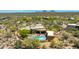 Bird's eye view of a luxury property featuring a pool with spa, a private patio, and desert foliage at 30600 N Pima N Rd # 81, Scottsdale, AZ 85266