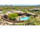 Expansive home features a backyard pool, spa, patio with seating, and lush desert landscaping at 30600 N Pima N Rd # 81, Scottsdale, AZ 85266